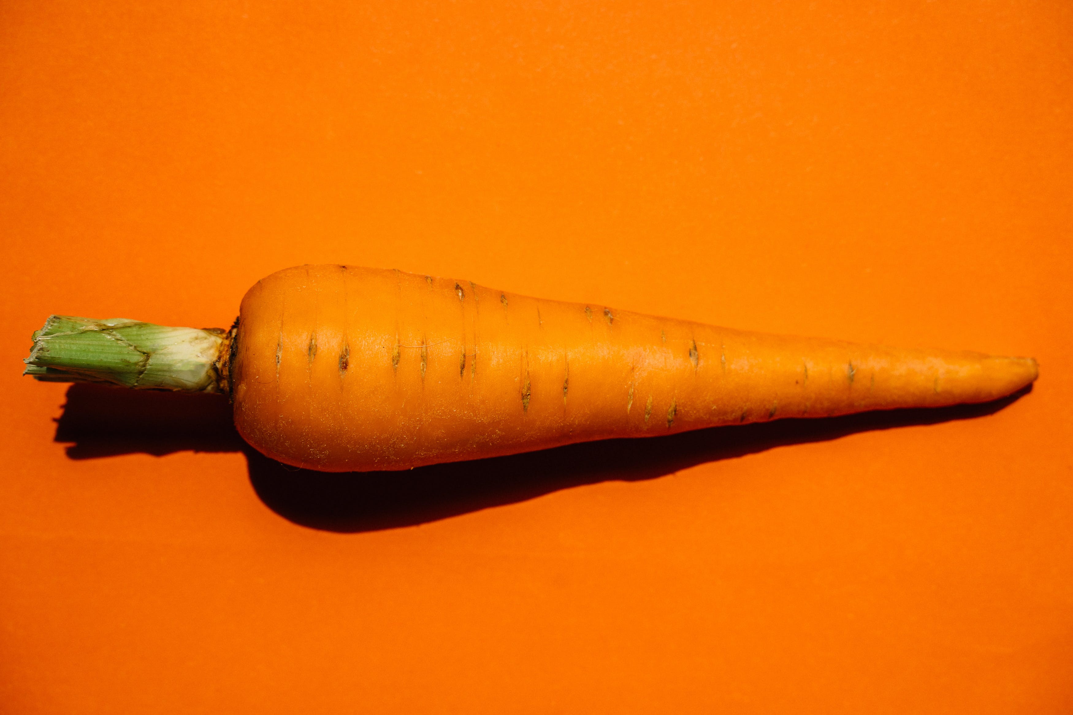Carrot Vegetable on Brown Wooden Table